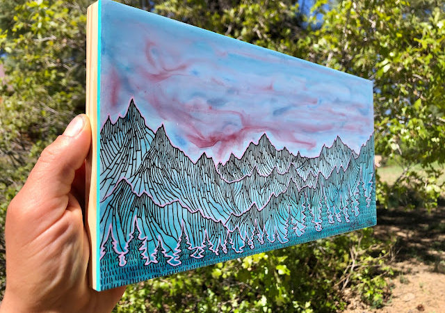 Pink Swirls Above the Mountains